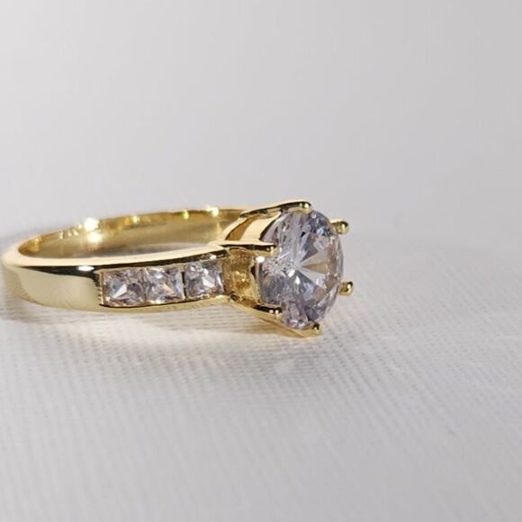 Simulated White Diamond Ring in a Goldtone Ring Size 8 - Picture 6 of 9
